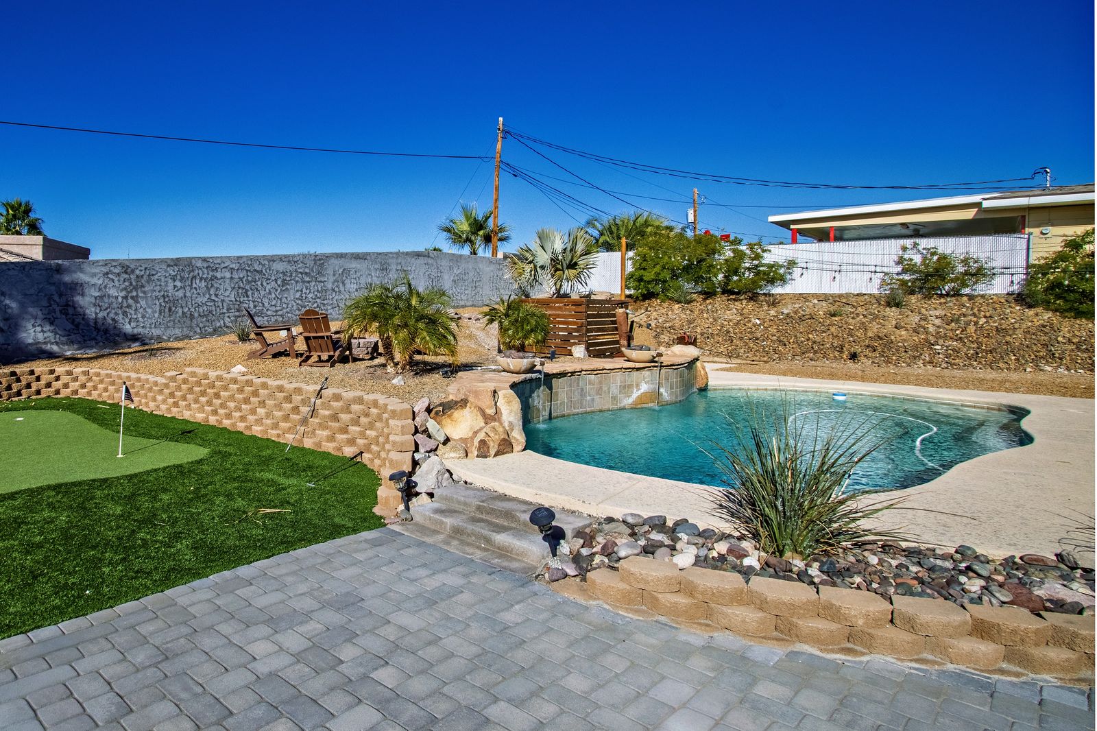Backyard with pool and putting green